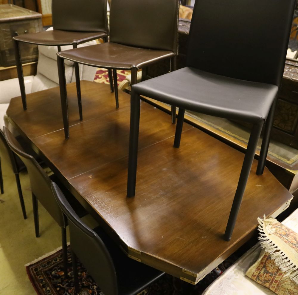 A military style mahogany and brass bound twin pillar dining table, width 182cm extended (one spare leaf) and six brown leather chairs